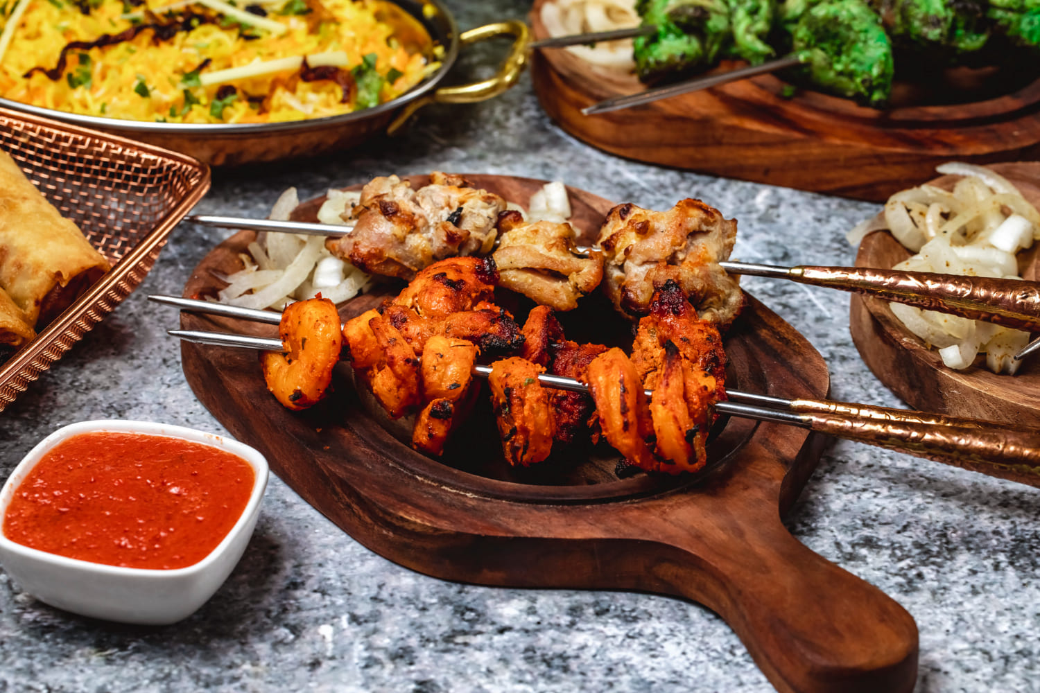 Elegantly presented Bang Bang Chicken Skewers on a serving plate.