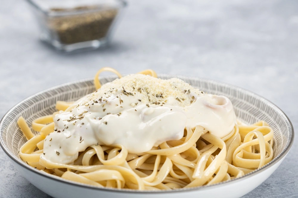 Brie Pasta with colorful seasonal vegetables