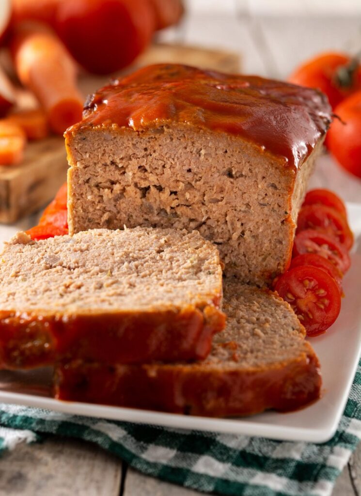 Glazing a classic meatloaf with Hunt's Meatloaf Sauce.