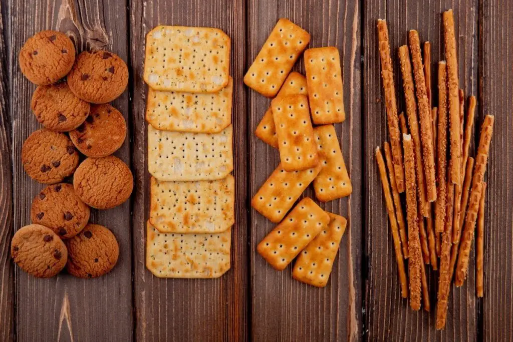 Artistic display of saltine crackers with varying textures and a soft-focus background.