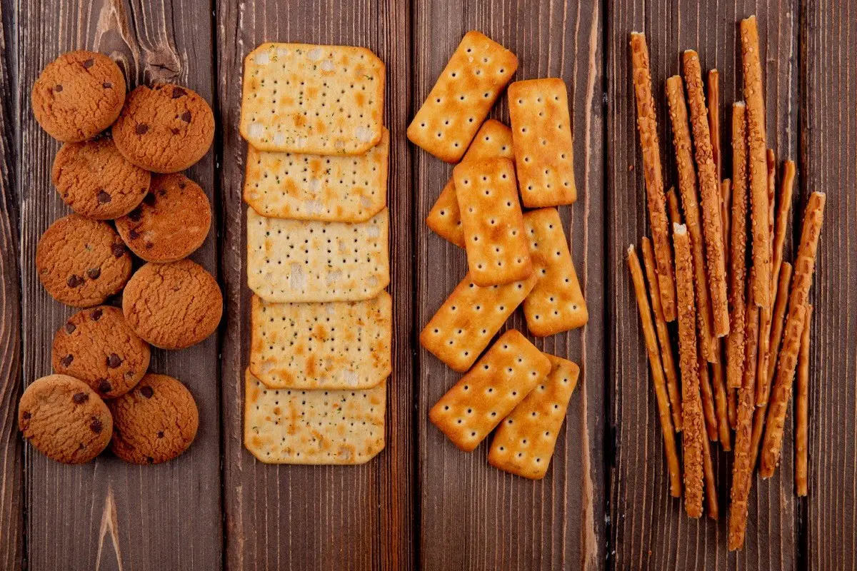 Artistic display of saltine crackers with varying textures and a soft-focus background.